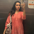 Shraddha Kapoor shows us how to effortlessly elevate workwear with a pop of color in an orange chikankari kurti