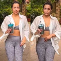 Malaika Arora styles her yoga look in a sports bra and matching leggings set with white shirt 