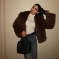 Khushi Kapoor nails winter fashion in a white turtleneck top, brown fur jacket, and a classic Dior bag