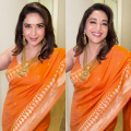 90s queen Madhuri Dixit has our hearts going Dhak Dhak all over again in a stunning bright orange saree