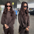  Disha Patani elevates travel fashion with a relaxed brown sweatshirt and jogger set at the airport