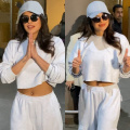 Priyanka Chopra takes her casual swag to the next level at Mumbai airport as she rocks the belly studs trend with  basic track pants and crop top