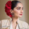 Sonam Kapoor pays tribute to late designer Rohit Bal; walks the ramp in long white dress and beige-toned jacket