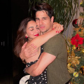 Kiara Advani adds a festive red pop to her sheer black polka dot Christmas dress as she shares a warm hug with Sidharth Malhotra