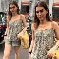 Kriti Sanon pairs sleeveless printed top with matching khaki green shorts and a high-end Chanel tote bag