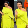 Karisma Kapoor embraces power of neon colors in asymmetrical gown with elegant front drape and long cape