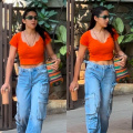  Sara Ali Khan mixes playful colors with practical style, pairing an orange crop top with trendy cargo jeans for a fresh look