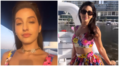 Nora Fatehi White Skirt And Crop Top,स्लिट स्कर्ट में उलझे बालों को संवारती  दिख