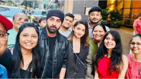 Ranbir Kapoor poses for paps in a white shirt and denims